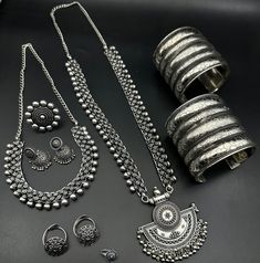 Luxury Oxidized Finish Temple Necklace For Festivals, Luxury Oxidized Temple Jewelry, Silver Heavy Sets For Diwali, Traditional Jewelry Sets With Latkans, Spiritual Silver Chandbali Jewelry, Traditional Silver Sets As Gift, Traditional Silver Sets For Gifts, Traditional Silver Sets For Navratri, Silver Temple Jewelry Sets For Festivals