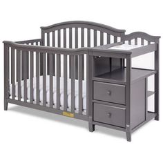 a baby crib with two drawers and a changing table next to it on a white background