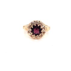 Vintage 1940's 10k yellow gold purple stone halo ring. The center stone is the color of a beautiful deep purple amethyst. The size of the ring is a 6, and has the ability to be resized. Vintage Yellow Gold Halo Jewelry, 14k Gold Purple Diamond Ring, 14k Gold Ruby Ring With Halo Setting, Vintage Gold Ring With Halo, Vintage 14k Gold Birthstone Ring With Center Stone, Vintage Round Cut Jewelry With Halo Design, Vintage Gold Jewelry With Halo Design, Formal Purple Birthstone Ring With Halo Setting, 14k Yellow Gold Amethyst Ring With Halo Setting