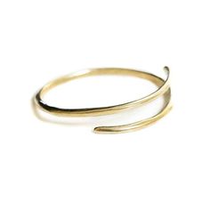 Brass or sterling silver bangle that wraps around wrist. Approximately 2 inches in diameter, can be adjusted by bending tighter or stretching wider. Modern Twist Adjustable Stackable Jewelry, Adjustable 14k Gold Jewelry With A Modern Twist, Minimalist Gold Cuff Bracelet In Sterling Silver, Adjustable Bracelet With A Modern Twist, Brass Bangle Bracelet For Everyday Wear, Minimalist Adjustable Gold Bracelet, Elegant Hand Forged Adjustable Bangle, Minimalist Adjustable Open Band Bracelets, Minimalist Adjustable Open Band Bracelet