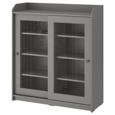 a gray cabinet with glass doors and shelves