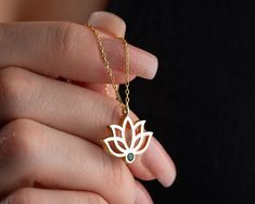 Elevate your style and spirituality with our Handmade Gold Lotus Necklace featuring a custom birthstone--a unique blend of personalized elegance and meaningful symbolism. Crafted with meticulous care, this exquisite piece is available in two exceptional materials: 925 sterling silver and 14K solid gold. Choose between the timeless allure of silver and the enduring warmth of gold, knowing that both options are of the highest quality. While the material is a significant choice, the true essence of this necklace lies in the delicate lotus pendant adorned with a custom birthstone. The lotus, a symbol of purity and enlightenment, is a captivating representation of beauty emerging from the depths. The added personal touch of a custom birthstone enhances the necklace's significance, making it a p Spiritual Yellow Gold Jewelry With Birth Flower, Spiritual Yellow Gold Birth Flower Jewelry, Symbolic May Birthstone Jewelry As Gift, Symbolic Rose Gold Jewelry Gift, Yellow Gold Jewelry With May Birth Flower, Spiritual Yellow Gold Birthstone Necklace Gift, Spiritual 14k Gold Gemstone Jewelry, Spiritual Gemstone Jewelry Gift, Spiritual Gemstone Jewelry As A Gift