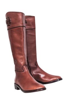 Saddle up in style with Tory Burch's Lowell Tall Riding Boots! Equestrian flair meets city sophistication for a luxe leather boot that's both traditional and timeless. The iconic Tory logo and rich chestnut brown color complete these charming riding boots. The perfect polished partner for midi dresses- giddy up and grab them before they're gone! Size 8 Leather upper & lining Leather & synthetic sole Almond toe Inside zip Stacked block heel Light marks on leather 2 small spots near top of left shoe Heel height 1.5" Shaft height 15.25" Circumference 15.75" Chestnut Brown Color, Brown Leather Riding Boots, Tall Riding Boots, Chestnut Brown, Leather Riding Boots, Buy Shoes Online, Tory Burch Shoes, Tall Boots, Chestnut