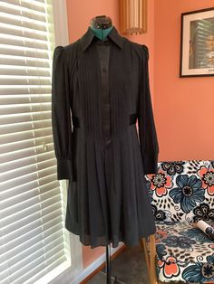 Beautiful Long Sleeve Silk Dress Made by Laundry by Design Tuxedo front buttons  Collared Satin button front strip and waist belt attached Pleated skirt 4" Cuffs Completely lined Knee length  Size 8 Shoulders -15 1/2" Sleeves -25" Bust -38 1/2" Waist -34" Hip - Free Length - 37 1/2" Excellent vintage condition, Beautiful No damages Semi-formal Fitted Shirt Dress With Button Cuffs, Classic Button-up Mini Dress For Office, Fitted A-line Shirt Dress For Casual Wear, Long Sleeve Shirt Dress With Pleated Waist For Daywear, Long Sleeve Mini Dress With Buttons For Semi-formal Occasions, Classic Button-up Party Dress, Formal Fitted Shirt Dress With Button Cuffs, Classic Mini Dress With Buttons For Daywear, Fitted A-line Shirt Dress With Buttons