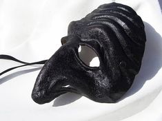 Pulcinella mask black dark leather costume larp renaissance wicca pagan burning man fantasy commedia Medieval Black Masks And Prosthetics For Fantasy Events, Black Medieval Masquerade Mask, Black Medieval Masquerade Mask For Fantasy Events, Medieval Black Masquerade Mask For Fantasy Events, Medieval Black Masquerade Mask, Medieval Style Black Masquerade Mask, Artistic Black Masks And Prosthetics For Theater, Artistic Black Masks And Prosthetics For Cosplay, Black Fantasy Theater Masks And Prosthetics