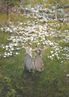 two women are standing in the grass with white flowers