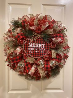 a christmas wreath hanging on the front door