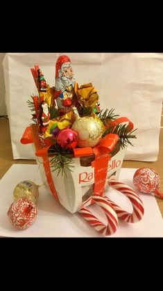 a basket filled with candy and candies on top of a table