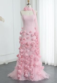 This gown is a striking shade of pink, featuring a strapless design with a sweetheart neckline that elegantly accentuates the collarbone and shoulders. The standout feature of the gown is the intricate 3D rose detailing, which adds a touch of romance and sophistication. The gown is complemented by a matching 3D rose neck choker, creating a cohesive and eye-catching look. This outfit is perfect for a formal event or a special occasion where you want to make a memorable impression.  Production tim 3d Flower Fashion, Rose Dress Design, 3d Dress Design, Rose Inspired Outfits, Dress Made Of Flowers, Rose Flower Dress, Pink Princess Gown, 3d Flower Dress, Pink Rose Dress