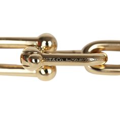 This Tiffany & Co Hardwear Medium Link Bracelet XL is in yellow gold hardware with diamonds, featuring medium sized links, two yellow gold links encrusted in 0.9 ct pavé diamonds, with a total carat weight of 1.39 and has a hook and clasp closure.Origin: ItalyCondition: New and never wornAccompanied by: Tiffany box, Tiffany jewelry boxMeasurements: bracelet circumference: approximately 7.75"; diameter: 2.5" Designer Gold-tone Chain Bracelets, Luxury Gold-tone Bracelet With 17 Jewels, Luxury Gold-tone Link Bracelets, Luxury Gold-tone Link Bracelet, Classic Gold Bracelets With Hooks And Links, Classic Formal Chain Bracelet With Hooks And Links, Formal Gold Link Bracelet With Hook And Links, Formal Gold Link Bracelet With Hooks, Designer Yellow Gold Chain Bracelet For Formal Occasions