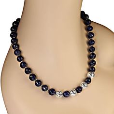 This is part of Chairish’s Fine Jewelry assortment.  Stunning 21-Inch Blue Sapphire Necklace with Silver Lava Rock Accents Add sophistication and sparkle to your jewelry collection with this 21-inch Blue Sapphire necklace featuring faceted 11 mm Blue Sapphire beads and eye-catching silver lava rock focal accents. This unique piece is designed to make a statement, with its deep blue tones and shimmering silver highlights.  Key Features: 11 mm Faceted Blue Sapphire Beads: These beautifully faceted Sapphire Beads, Silver Highlights, Blue Sapphire Necklace, Hammered Sterling Silver, Lava Rock, Sapphire Necklace, Silver Accents, Blue Tones, Deep Blue