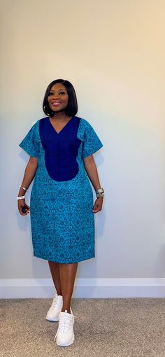 Be fashionably adorned in this gorgeous shift dress with  side pockets and made with 100% African wax cotton As always our designs are fully handmade, comfortable and perfect fit to suit all body types. Please feel free to inform us about any customization options or preference.  We will proceed with selected standard UK  / customized size within 12 - 24hours of purchase Model is wearing size 8 (Small) Please DM your custom measurement if you have it. Waist Bust Length  Round Arm   Please see ou African Dresses For Elderly Women, Ankara Shift Dresses For Women, Ankara Free Dresses For Women, Cotton V-neck Shift Midi Dress, Cotton Shift Dress With V-neck, Blue Cotton Shift Dress, Blue Cotton Shift Midi Dress, Blue Cotton Midi Dress With Pockets, Blue Cotton Dress With Pockets