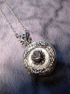 Silver Rose Locket Necklace The Locket measures 32mm round (1.25 inches round) Chain: - Silver Plated - YOU CHOOSE YOUR CHAIN LENGTH FROM DROP DOWN MENU TOOL ☻☻ TO see MORE of our LOCKET NECKLACEs (while supplies last): https://www.etsy.com/shop/FashionCrashJewelry/search?search_query=locket&order=date_desc&view_type=gallery&ref=shop_search ☻☻TO VIEW ADDITIONAL OPAL JEWELRY SELECTIONS: https://www.etsy.com/shop/FashionCrashJewelry/search?search_query=OPAL&order=date_desc&view Vintage Jewelry With Rose Design Flower Pendant, Vintage Rose Design Flower Pendant Jewelry, Round Rose Design Jewelry For Anniversary, Formal Round Rose-colored Jewelry, Vintage Rose-colored Jewelry For Weddings, Vintage Rose Wedding Jewelry, Vintage Rose Design Jewelry In Rose Color, Vintage Rose Design Jewelry, Adjustable Vintage Rose Jewelry