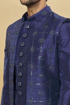 Blue front open longline bundi with sequin and floral embroidery. Paired with kurta and aligarhi pant.
Component: 3
Pattern: Embroidered
Type Of Work: Floral and Sequin
Neckline: Jacket: Open
Sleeve Type: Kurta: Full Sleeves
Fabric: Art Silk, Dupion Art Silk
Color: Blue
Other Details: 
Sequin work
Embroidered jacket
Occasion: Wedding - Aza Fashions Designer Nehru Jacket With Mirror Work For Festivals, Blue Nehru Jacket With Intricate Embroidery For Diwali, Blue Bandhgala With Mirror Work For Festive Occasions, Diwali Blue Nehru Jacket With Intricate Embroidery, Blue Bollywood Bandhgala With Mirror Work, Designer Blue Nehru Jacket With Zari Work, Blue Bandhgala With Mirror Work For Wedding, Wedding Blue Bandhgala With Mirror Work, Designer Blue Nehru Jacket With Intricate Embroidery