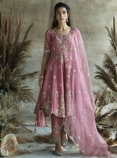 This set features a short onion silk anarkali suit with organza dupatta and potli. Fabric: Silk Color: Pink Care: Dry Clean Only Silk Anarkali Suits, Pink Anarkali, Walima Dress, Silk Anarkali, Embroidered Anarkali, Anarkali Dress Pattern, Pakistani Fashion Party Wear, Traditional Indian Outfits, Designer Party Wear Dresses