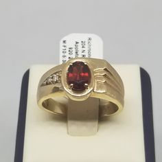 Vintage 10K Yellow Gold with Garnet & Diamonds Ring, Size 10.5. Stamped 10K Rogers inside band. Main stone is 7 x 5mm. Ring is 10mm wide. Weighs 3.3 dwt. We do not check prongs for wear or stones for looseness. All items are sold as is-noting that we are a resale shop so everything here had a previous owner! We will include flaws in the description when noted. This is one of the reasons our items are more affordable than new at a jewelry store. Are these stones real or fake? Aside from diamonds, we do not know if any gemstones are natural or synthetic. We will state on certain gemstones, that we know 100%, if they are created or fake due to their lack of inclusions. For this reason, we do not sell any diamonds without inclusions, and the larger diamonds (half ct+) are soft graded. In recen Garnet And Diamond Ring, European Jewelry, Vintage Fine Jewelry, Diamonds Ring, Pure Gold, Selling Jewelry, Jewelry Store, Rings Statement, Diamond Rings