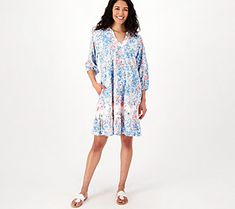 Who says summer has to be all shorts and tees? (Not us!) Mix up your fun-in-the-sun mojo with this pretty printed dress boasting a frilly ruffle trim. Its elevated yet relaxed style fits right in with your minimal effort plans without sacrificing warm-weather comfort. What can we say -- one-piece dressing is one-derful! From the Tolani Collection. Spring V-neck Beach Dress, Casual V-neck Sundress For Summer Outings, Spring Knee-length Beachwear Dresses, Summer Tiered Printed Dress, Relaxed Fit Ruffle Dress For Beach, Relaxed Fit Ruffled Dress For The Beach, Spring Short Sleeve Sundress Beach Dress, Tiered Cotton Sundress For Summer, Cotton Tiered Sundress For Summer