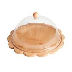 a wooden platter with a glass dome on top