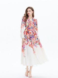 Bathed in a tapestry of floral splendor, this long-sleeved maxi dress radiates a romantic aura fit for any dreamy occasion. With its rich mosaic of vibrant blossoms that cascade from the shoulders to the hem, the dress evokes the splendor of a flourishing garden. The bodice, graced with a deep v-neckline, gives way to a cinched waist, where the pattern converges to flatter the figure before flowing out into an A-line skirt that whispers of elegance with every movement. The sheer sleeves billow gently to the wrists, offering a hint of whimsy and grace. This dress is a wearable piece of art that calls to those who carry an appreciation for nature’s beauty and a love for fashion that makes a statement. Pattern: printingStyle: pulloverSkirt length: long skirtSkirt type: large swing typeCollar Spring Bohemian Fitted Long Sleeve Dress, Bohemian Fitted Long Sleeve Dress For Spring, Long Sleeve Dresses With Floral Patchwork For Spring, Spring Floral Patchwork Long Sleeve Dress, Multicolor Floral Patchwork Maxi Dress For Spring, Spring Multicolor Floral Patchwork Maxi Dress, Elegant Long Sleeve Maxi Dress For Spring, Bohemian Long Sleeve Floral Summer Dress, Bohemian Fitted Maxi Dress With Floral Patchwork