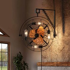 a living room with a fan on the wall next to a fire place and window