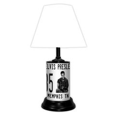 the elvis presley lamp is on display in front of a white background and black base