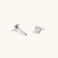 Our classic tiny crystal studs elevated to the stars in a prong setting. Introducing the Nap Earrings Collection - our signature push pin flat backs designed for 24/7 poke-free wear! Made from medical grade titanium to be safe for sensitive skin. And, for the first time, we made them in 20g (aka the same thickness as traditional earrings), so they’re perfect for lobe piercings! The push pin earring posts are easy to insert and remove from your ear, and the flat back makes them super comfortable Classic Round Internally Threaded Nose Studs, White Gold Round Nose Studs With Internally Threaded, Middle Cartilage Piercing, Internally Threaded White Gold Nose Stud, Silver Celestial Crystal Earrings For Pierced Ears, White Gold Internally Threaded Round Nose Stud, Minimalist Hypoallergenic Sterling Silver Crystal Earrings, Classic Silver Screw Back Earrings, Nap Earrings