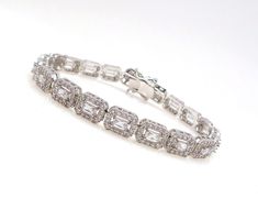 magnificent Cubic Zirconia Wedding Bracelet starring rectangle halo Cut Cubic Zirconia with delicate CZ pave. Our bracelet is the perfect accessory for brides, bridesmaids, mothers of the bride and pageants. Each stone size: 11mm x .8mm. matching earrings available and sold separately. Halo Cut, Bridal Bracelets, Bracelets Christmas, Christmas Pageant, Wedding Bridesmaid Jewelry, Large Necklace, Jewelry Bridesmaid, Christmas Bracelet, Bridal Bracelet