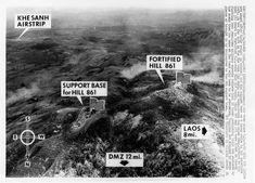 black and white photo of an aerial view of hills with signs pointing in different directions