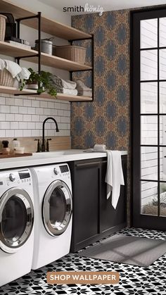 a washer and dryer sitting in front of a window