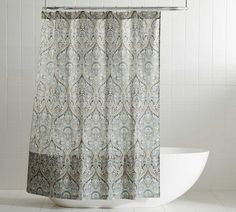 a shower curtain with an ornate pattern on it