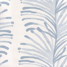 a blue and white wallpaper with palm leaves on the back drop in shades of grey