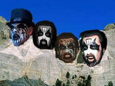 the faces of three men with painted face paint on them are in front of a mountain