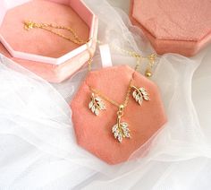 "A very special and unique gift set for your bridesmaids! Our special gift set includes lovely earrings and necklaces in a luxurious velvet jewelry box with customized texts! Necklace and Earring Sets and Lovely Velvet Personalized Jewelry Box! Anniversary, Engagement, Gift, Party, Wedding, Birthday gifts! \"We guarantee our product quality as we handpick them personally with additional care.\" ♥ Material: Gold plated ♥ Main Stone: Zircon ♥ Available with Monograms: Gold, Rose Gold, Silver-color Gold Leaf Pendant, Gift Box Birthday, Personalized Jewelry Box, Bridesmaid Gift Boxes, Wedding Gifts For Bridesmaids, Holiday Christmas Gifts, Lovely Earrings, Leaf Pendant, Necklace Earring Set