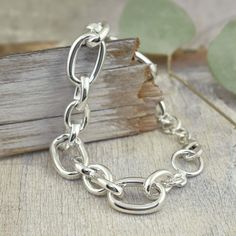 It's just my style! Our Linked-Up Bracelet comes to you in handcrafted sterling silver. The rich silver links vary in size and width with smooth oval-shaped shine. The bracelet measures approximately 1-inch at the widest and 3/8-inches at the narrowest. Available in two sizes: Standard measures 8-inchesLarge measures 9-inches (for a small additional fee) Note: Due to the chunky links, the 8-inch fits standard wrist size and the 9-inch fits large size wrist. If you love heavy silver chunky pieces Sterling Silver Bracelets With Chunky Chain In Oval Link, Silver Oval Link Chunky Chain Bracelet, Silver Bracelets With Chunky Oval Link Chain, Modern Sterling Silver Chunky Chain Bracelet, Everyday Sterling Silver Bracelet With Chunky Chain, Silver Oval Link Chain Bracelet, Sterling Silver Oval Link Bracelet With Polished Finish, Modern Oval Sterling Silver Bracelet, Modern Sterling Silver Bracelet With Rolo Chain