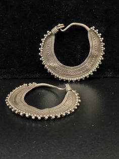 "These wonderful ornate large Sindh Hoop Earrings are handcrafted, ancient Tribal Jewelry earrings from the Indus River Valley, which winds through the Himalayas, across Kashmir into the Punjab. The area it covers enjoys a rich cultural history going back thousands of years. 2 1/2\" Circle Round also known as Huge Vintage Afghan Silver Saw-Blade Hoop Earrings made of high-quality Sterling Silver. These earrings are rather heavy and can be used as earweights. Open studio most days 10:00 to 5:00, Traditional Oxidized Hoop Earrings For Festive Occasions, Ornate Chandbali Hoop Earrings With Intricate Design, Ornate Handmade Hoop Earrings, Handmade Ornate Hoop Earrings, Handmade Jewelry For Traditional Ceremonies And Festivals, Vintage Round Hoop Earrings With Intricate Design, Traditional Chandbali Hoop Earrings With Intricate Design, Artisan Oxidized Hoop Earrings, Traditional Hoop Earrings With Intricate Design For Festivals