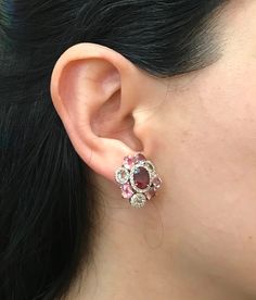 A Statement Earring handcrafted in Rose Gold Plated over Sterling Silver features a center Garnet embellished with Multi-color Spinel and Tourmaline and Halo Diamonds. A stunning, jaw-dropping stud earrings that makes a commanding statement earrings.(e-c-63) Earring measure 9mm x 20mm *LIKE* us on Facebook http://www.facebook.com/Belesas to get 10%off coupon code, *FOLLOW* us on Twitter https://twitter.com/#!/Belesas to get more exclusive coupon codes *All item are ready to ship! Free shipping o Unique Multi-stone Earrings For Formal Occasions, Unique Formal Multi-stone Earrings, Pink Multi-stone Earrings In Fine Jewelry Style, Pink Multi-stone Earrings Fine Jewelry, Pink Multi-stone Earrings For Anniversary, Elegant Red Multi-stone Earrings, Multicolor Gemstone Accented Earrings For Wedding, Pink Multi-stone Earrings For Gift, Multicolor Gemstone Accent Earrings For Wedding