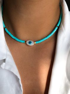 SUMMER DAY (turquoise) * Beaded Enameled Chain (4mm) * Mother of Pearl (Evil Eye) * Golden natural hematite square beads * Total length: 50 cm * Adjustable: yes * Waterproof: yes * Hypoallergenic stainless steel chain and carabiner * Perfect for layering * Goes with any chic outfit * Good vibes only! ➪  𝐴𝑙𝑙 𝑃𝑟𝑜𝑑𝑢𝑐𝑡𝑠 𝑎𝑟𝑒 𝑐𝑎𝑟𝑒𝑓𝑢𝑙𝑙𝑦 𝑝𝑎𝑐𝑘𝑎𝑔𝑒𝑑 𝑤𝑖𝑡ℎ 𝑙𝑜𝑣𝑒.  ➪  𝑃𝑎𝑐𝑘𝑎𝑔𝑒 𝑖𝑛𝑐𝑙𝑢𝑑𝑒𝑠: 𝐼���𝑡𝑒𝑚 (𝑜𝑓 𝑐𝑜𝑢𝑟𝑠𝑒), 𝑎 𝑙𝑜𝑣𝑒𝑙𝑦 𝑉𝑒𝑙𝑣𝑒𝑡 𝐺𝑖𝑓𝑡 𝑏𝑎? Necklace Choker Gold, Jewelry 2024, 2024 Jewelry, Blue Polymer Clay, Choker Gold, Square Beads, Hippie Necklace, Polymer Clay Necklace, Clay Necklace