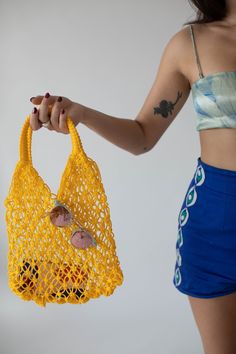 Origin: Handmade in Morocco  Colors: available in a wide range of colors  Description: Inspired by vintage net bags made popular in french markets. The beauty of this bag is its simplicity but also its versatility. It can be used in endless ways! It is definitely your go-to farmer's market bag. Its nautical net vibes make it the perfect beach companion. Or show off (and air out) your cute athletic wear to and from the gym. Chic Yellow Crochet Bag For Daily Use, Chic Yellow Crochet Bag, Chic Yellow Crochet Tote Bag, Chic Yellow Rectangular Crochet Bag, Yellow Crochet Bag For Spring, Spring Yellow Crochet Bag, Vintage Crochet Bag For Daily Use In Summer, Vintage Crochet Shoulder Bag For Summer, Spring Market Shoulder Bag