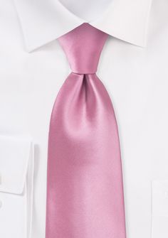 This carnation-pink tie with a subtle wash is the ideal accessory for a day full of sunshine. This is a very fashionable option for bridesmaids and groomsmen to wear to weddings in the spring and summer because of the outstanding shine and the pink color. Yet, if you are seeking a contemporary summer ensemble, this tie is equally as well suited for work clothing as it is for casual wear. To complement this tie, we advise opting for a suit in a light or medium grey shade and a traditional white d Pink White Dress, Carnation Pink, Dress Shirt And Tie, Pink And White Dress, White Dress Shirt, Shirt And Tie, Pink Solid, Work Clothing, Bridesmaids And Groomsmen