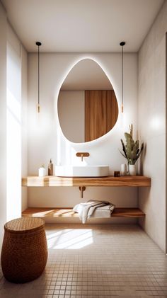 a bathroom with a round mirror above the sink