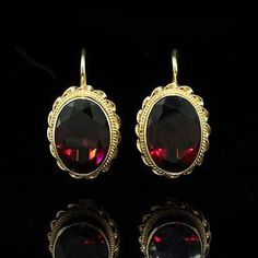 Garnet Earrings Antique Style Wire Back Gold Gemstone Oval Red Garnet Yellow Gold Vintage Handmade antique reproduction with twisted wire design and wire backs, with oval garnets (Approx. 11cttw). Earring are 17mm long and 13mm wide (6/10 x 5/10 inch) and made of 14k yellow gold. This style is also available in white gold and a variety of other gems such as: Citrine, Blue Topaz and Amethyst. Please contact us if you are interested in any of these options. PROUDLY MADE FROM SCRATCH IN NEW YORK CI Classic Oval Single Earring, Formal Oval Pendant Gemstone Earrings, Classic Oval Earrings For Evening, Oval Gemstone Earrings For Evening, Red Oval Gemstone Earrings, Classic Oval Earrings With Ear Wire, Classic Oval Red Earrings, Red Oval Classic Earrings, Classic Red Oval Earrings