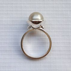 Minimalist South Sea Pearl engagement ring in silver tones Sterling silver pearl ring A romantic gift for engagement, anniversary and birthday Handmade and designed by Barock Pearl Pearl: shape round, color silver, size 9 mm South Sea Pearl cultured/grown at Lombok Island, Indonesia Ring size: please select the size from the chart For orders more than 250 $ US FREE SHIPPING. Shipping with EMS Parcel, approx. 10 to 15 working days. Don't forget to leave your phone number to complete the address Modern Wedding Pearl Ring, Modern Pearl Open Ring For Anniversary, Modern Open Pearl Ring For Anniversary, Modern Sterling Silver Dome Ring For Wedding, Minimalist Pearl Ring For Wedding, Elegant Sterling Silver Dome Ring Gift, Sterling Silver Dome Wedding Ring, Round Sterling Silver Dome Wedding Ring, Modern Silver Dome Ring For Wedding