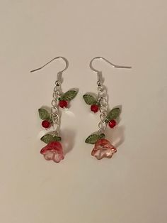 'Blooming Beauty' handmade dangling earrings, perfect for valentine's day!  These gorgeous flower earrings are available in multiple colours and are bound to be gratefully received by your partner, bestie, or even as a gift to yourself this v-day.  The Blooming Beauties are decorated with two small bead and leaf charms, as well as a statement flower and leaf at the end of the chain.  Colours may vary in quantity and price.  All orders are highly appreciated and made with the most love and care <3 Handmade Drop Flower Earrings For Valentine's Day, Handmade Flower Earrings For Valentine's Day, Dainty Jewellery, Coquette Vintage, Valentine Gifts For Girlfriend, Gift Girlfriend, Beads Bracelet Design, Jewelry Accessories Ideas, Funky Jewelry