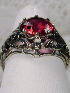 Ruby Ring, sterling silver floral filigree, daisy design #D66 Elegant Silver Ruby Flower Ring, Red Ruby Filigree Ring For Wedding, Red Victorian Filigree Ring For Anniversary, Red Flower Ring For Formal Occasions, Red Vintage Filigree Ring With Gemstone, Red Ruby Filigree Ring Gift, Red Ruby Filigree Ring, Red Victorian Filigree Ring With Gemstone, Ornate Filigree Ring For Promise