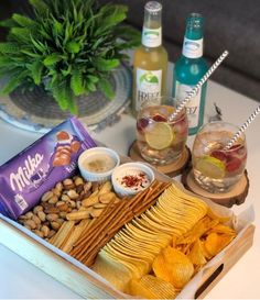 an assortment of snacks and drinks on a table