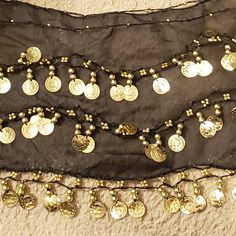 Belly Dance Hip Dance Coin Scarf, Black Sheer With Gold Tone Coins Scarf, Nwot Brand New-Never Used Sheer Black Belly Dance Hip Dance Coin Scarf, With Gold Tone Coins 100% Polyester Nwot Approx Measurements: Length 49" Width Mid Point 10" Hip Dance, Jug Of Water, Desert Trip, The Last Drop, In The Desert, Belly Dance, The Desert, Scarf Wrap, Enchanted