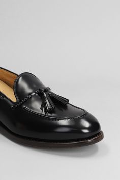 Loafers In Black Leather Classic Black Slip-on Tassel Loafers, Black Round Toe Tassel Loafers For Business, Elegant Black Tassel Loafers With Stitched Sole, Black Slip-on Tassel Loafers With Rubber Sole, Black Moc Toe Tassel Loafers With Rubber Sole, Black Tassel Loafers With Rubber Sole And Moc Toe, Black Tassel Loafers With Moc Toe And Rubber Sole, Black Plain Toe Loafers With Leather Sole, Black Plain Toe Slip-on Tassel Loafers