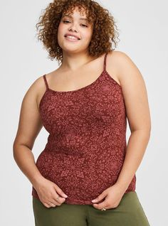 FIT Model is 5'10. 5” wearing size 1. Measures 30” from shoulders (size 2). MATERIALS + CARE Foxy knit fabric: Holds you in, smooths you out and doesn't ride up. Stretch level: Maximum. 95% cotton, 5% spandex. Machine wash cold. Tumble dry low. Imported. DETAILS Scoop neckline . Sleeveless. Adjustable straps. . The best plus size women's foxy cami in pretty medallion fired brick made of foxy. Rock your look from Torrid to Festivals like Coachella and Lollapalooza, a concert, a show, or just for Fitted Camisole Tops For Fall, Disney Leggings, Red Plum, Shoes For Leggings, Winter Clothes, Cozy Fall, Cami Tanks, Scoop Neckline, Knit Fabric