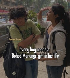 two people standing next to each other on a sidewalk with the caption every boy needs a bohol marung girl in his life