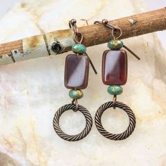 Brown Boho Dangle Earrings crafted with care, a must-have for fall.  Made with high-quality bronze finish, these earrings exude elegance and sophistication.  Adorned with captivating Czech glass beads, they add a touch of vibrancy and uniqueness to your outfit. Artisan glass beads produced in small quantities in the Czech Republic Hypoallergenic ear wires (nickel and lead free). Select ear wire style at checkout. A gift for you or someone special, earrings are carded and in an organza bag. Link Boho Earrings Outfit, Special Earrings, Copper Accents, Earring Crafts, Earrings 3, Copper Finish, The Czech Republic, Hand Made Jewelry, Glass Earrings